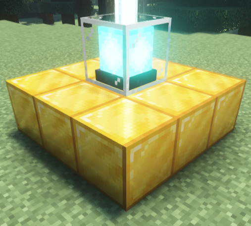 A Minecraft beacon placed on a 3x3 gold block base, emitting a bright light beam into the sky.