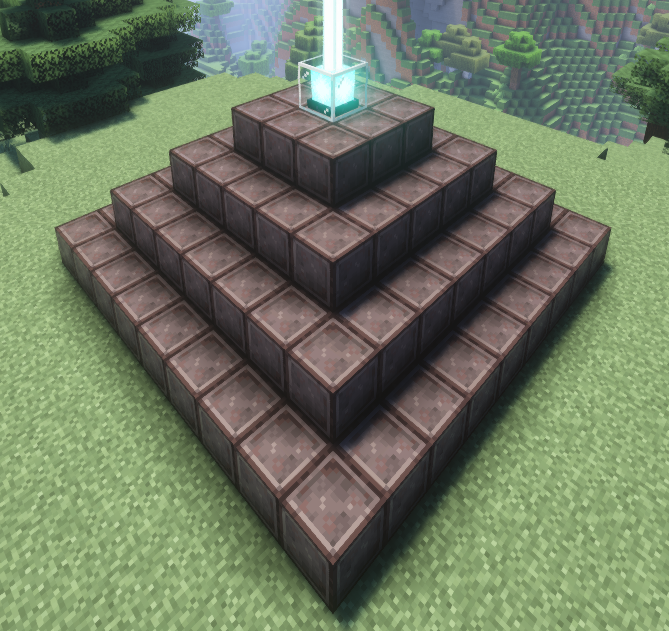 A fully powered Minecraft beacon with a 4-tier pyramid made of netherite blocks, emitting a bright light beam into the sky.