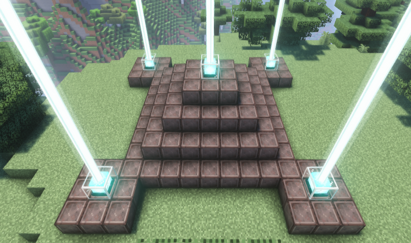 A multi-beacon setup in Minecraft with a pyramid base made of netherite blocks, featuring five beacons emitting bright light beams into the sky.