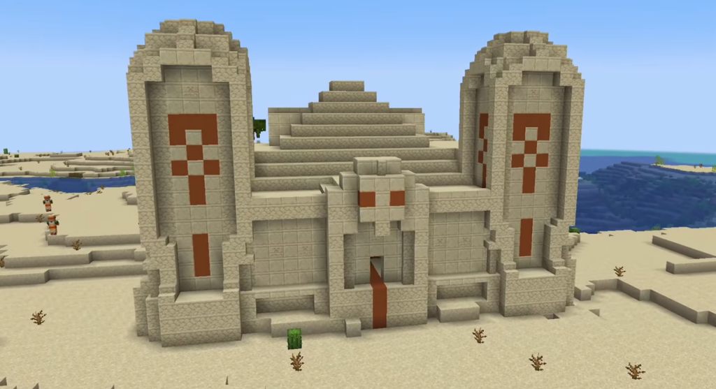 A redesigned desert temple from the Project ReDev Minecraft mod, featuring enhanced architecture, detailed sandstone textures, and a more imposing entrance.