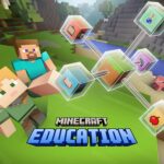 Minecraft Education promotional image featuring Steve and Alex sitting on the grass in a blocky, vibrant landscape. Floating educational icons, such as a book, potion, and apple, connect to a central cube. A pig stands near a river in the background.